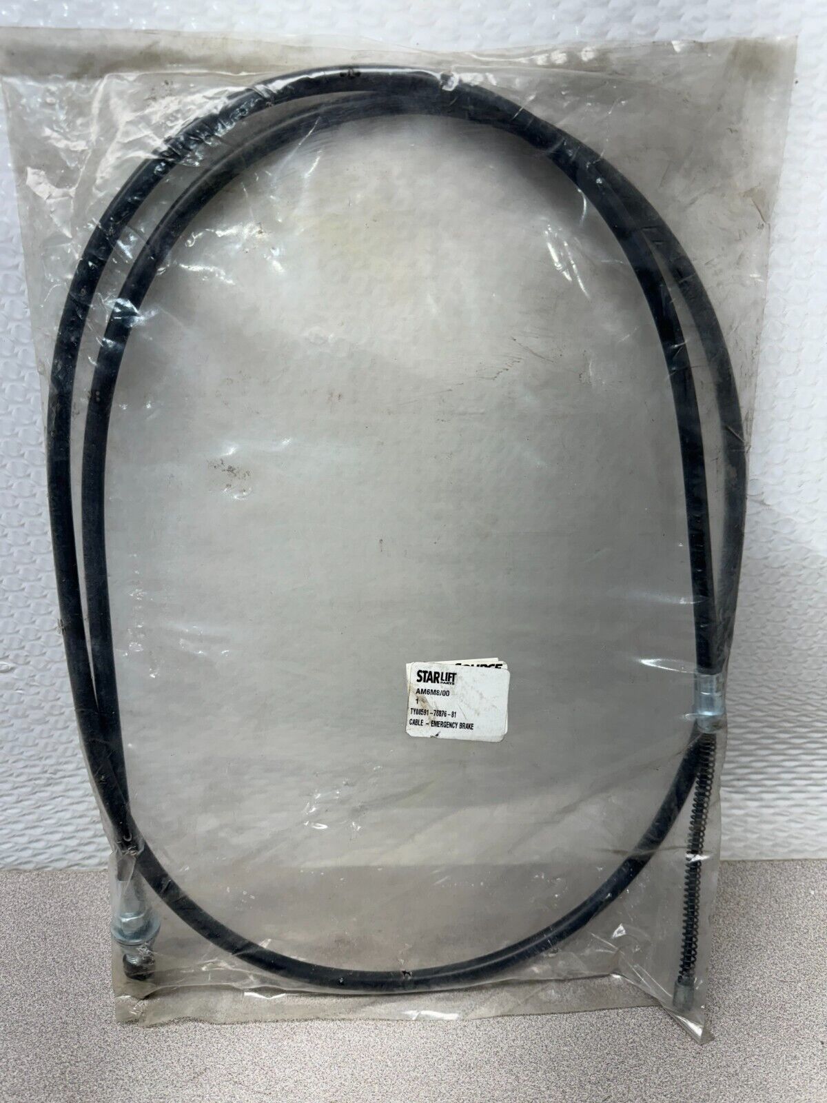 NEW IN PACKAGE STARLIFT CABLE - EMERGENCY BRAKE AM6M8/00 TY00591-76876-81