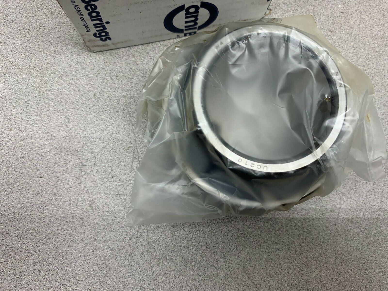 NEW IN BOX AMI BEARINGS UC210