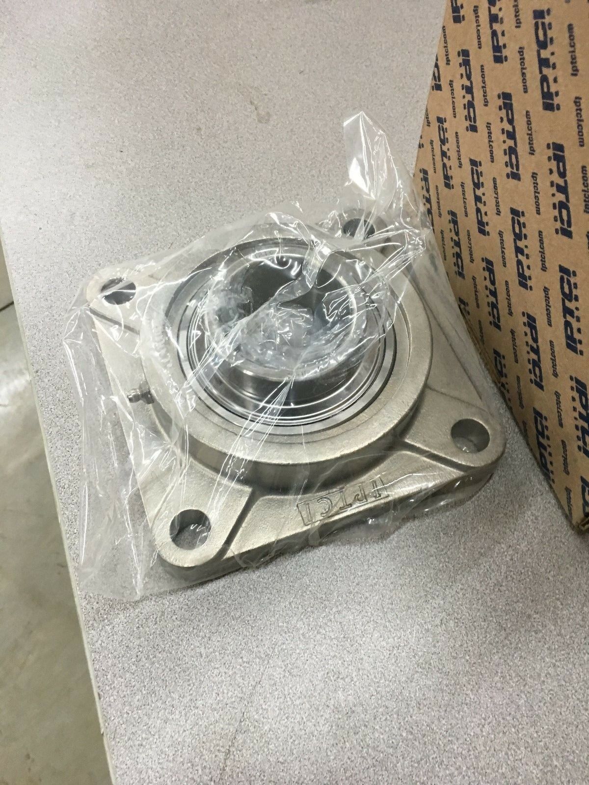 NEW IN BOX IPTCI 4-BOLT FLANGED BEARING 2-3/16" BORE SUCSF 211 35