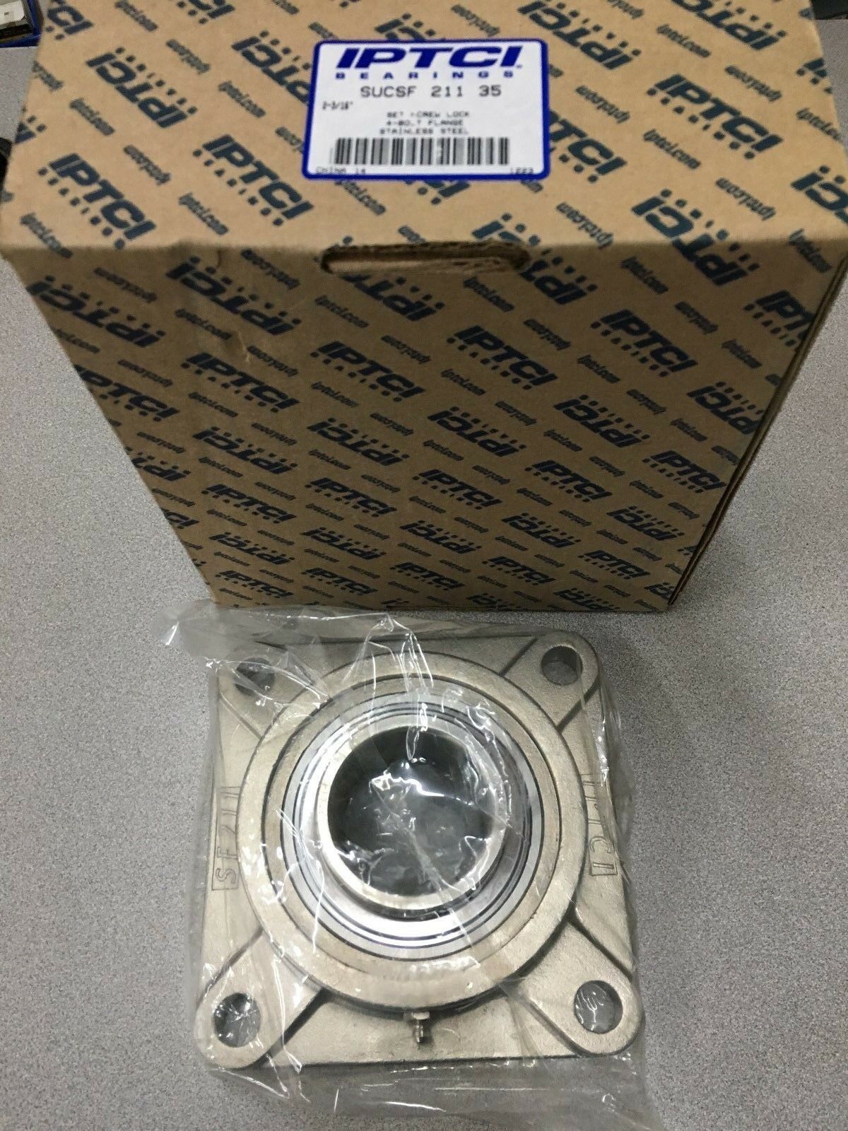 NEW IN BOX IPTCI 4-BOLT FLANGED BEARING 2-3/16" BORE SUCSF 211 35