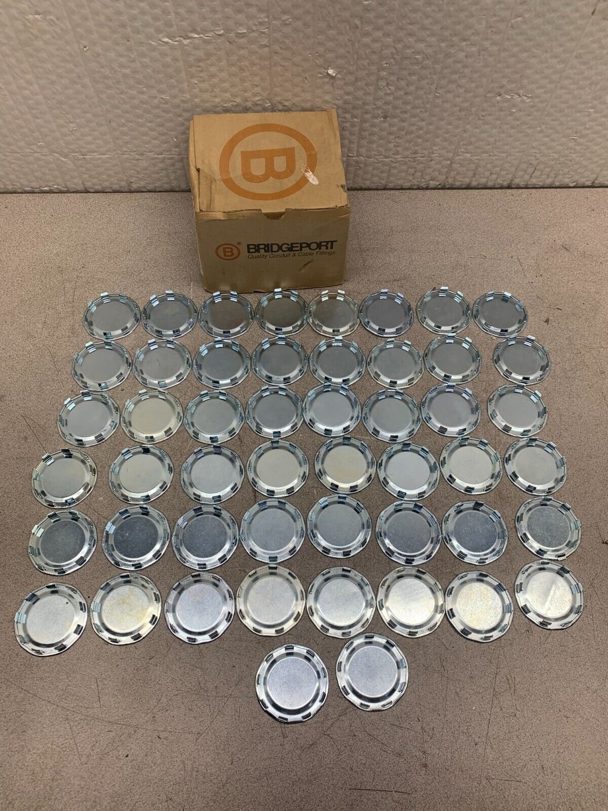 NEW BOX OF 50 BRIDGEPORT 1-1/2" STEEL KNOCKOUTS 1695