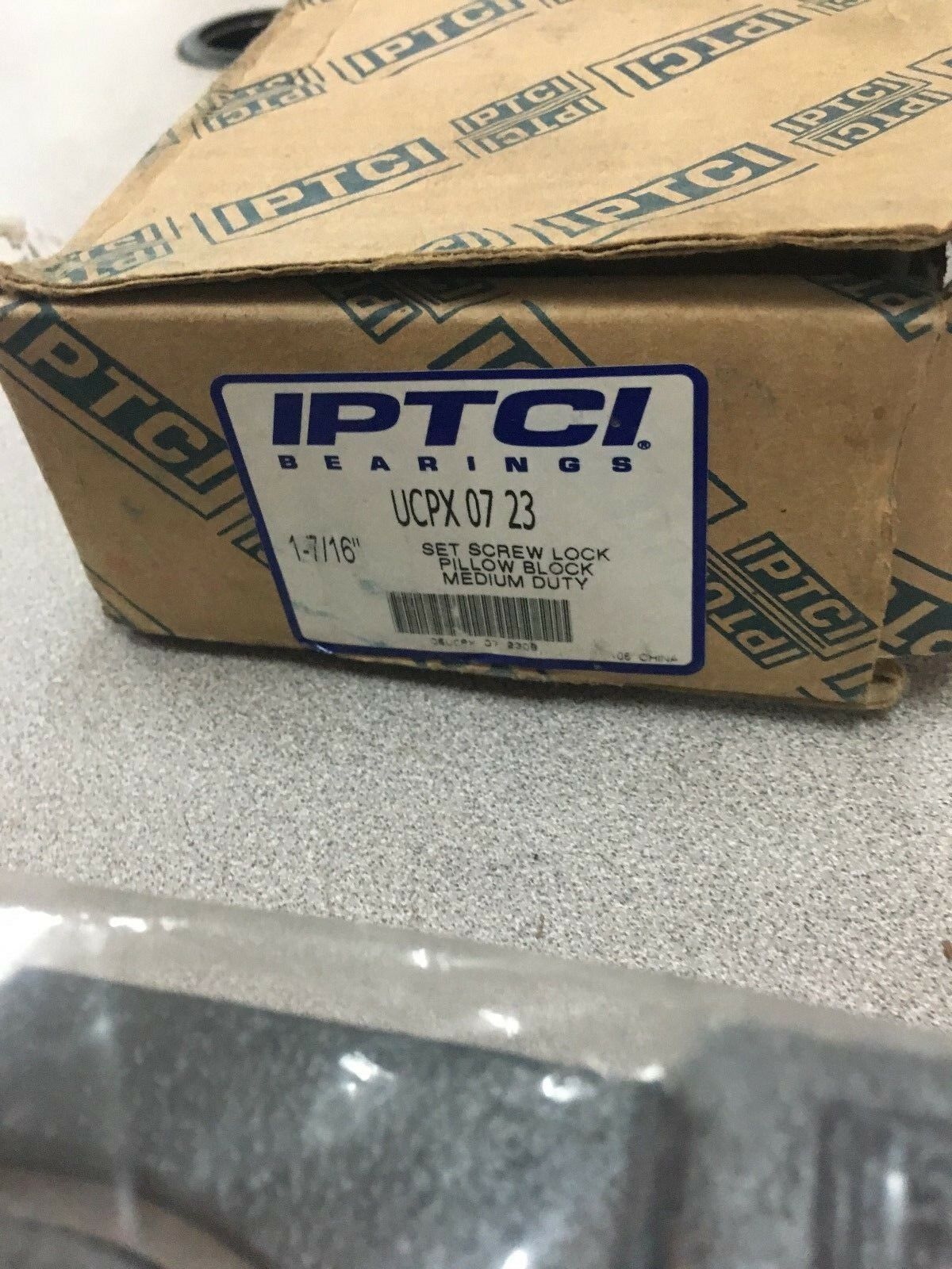 NEW IN BOX IPTCI PILLOW BLOCK BEARING 1-7/16" BORE  UCPX 07 23