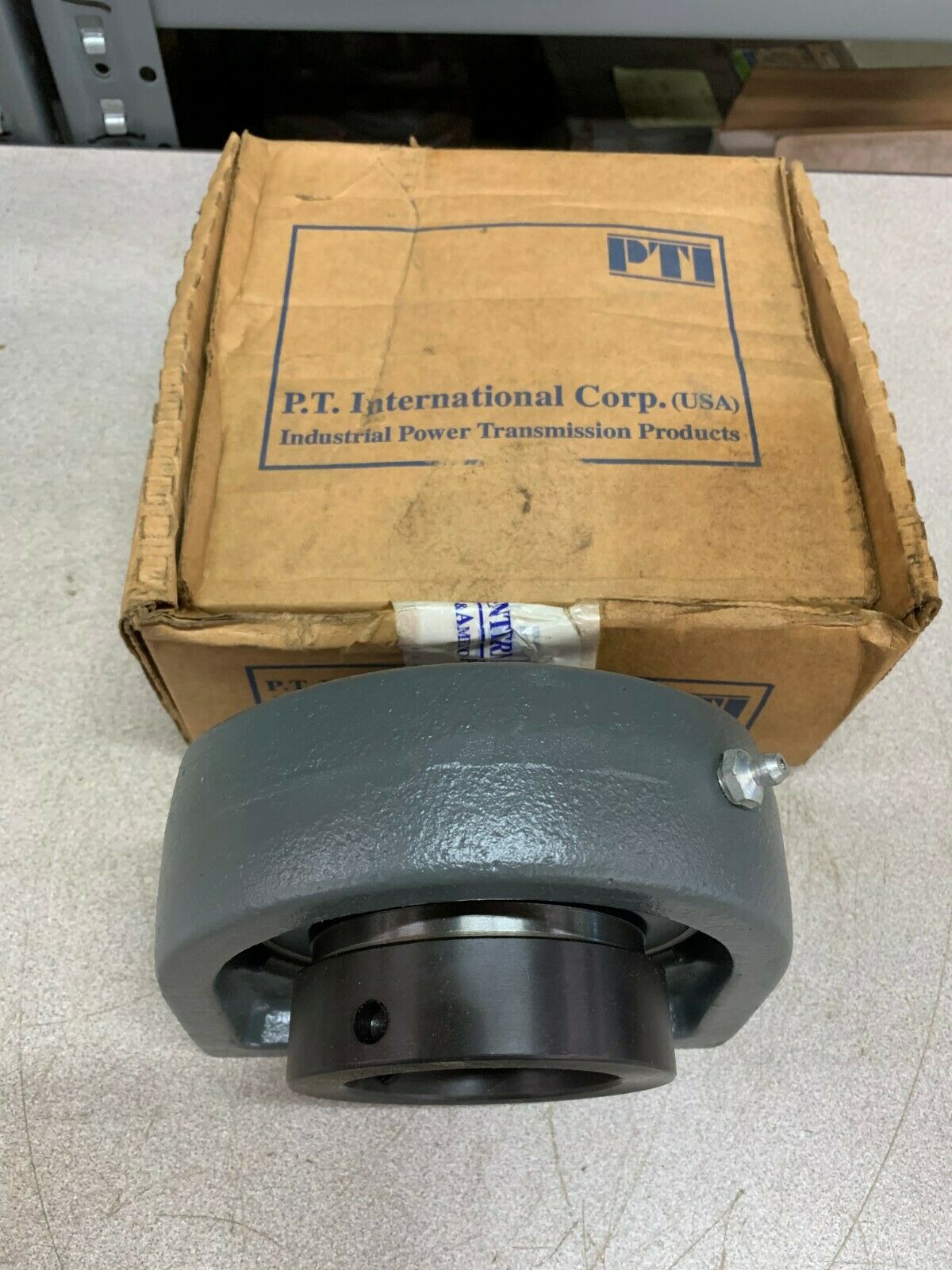 NEW IN BOX PTI TAPPED BASE PILLOW BLOCK BEARING SWG212-60AMM